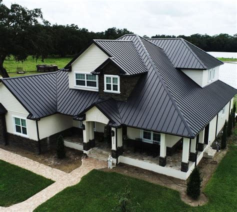 houses with black metal roofs|exterior house colors black roof.